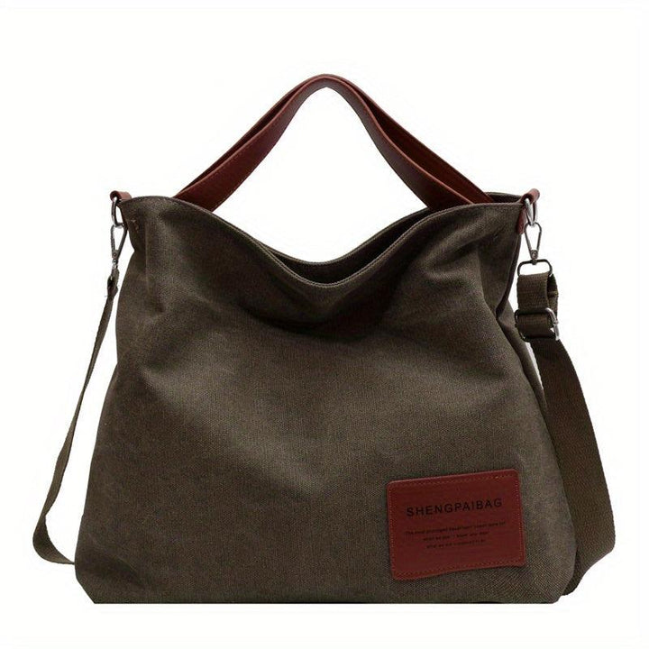 Sac unisexe en toile robuste, bandoulière confortable. Design pratique et polyvalent pour tous.