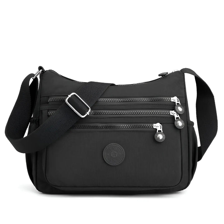 Sac à bandoulière pour femmes, imperméable et spacieux, parfait pour organiser vos essentiels en voyage ou au quotidien.