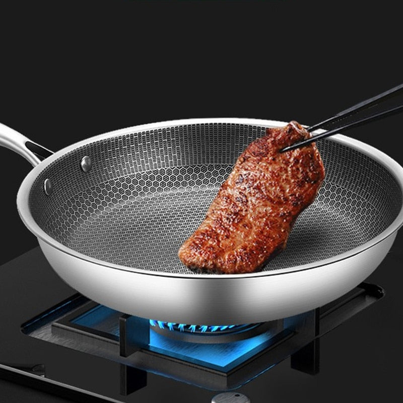 Poêle universelle antiadhésive en acier inoxydable pour cuisson saine sur induction.