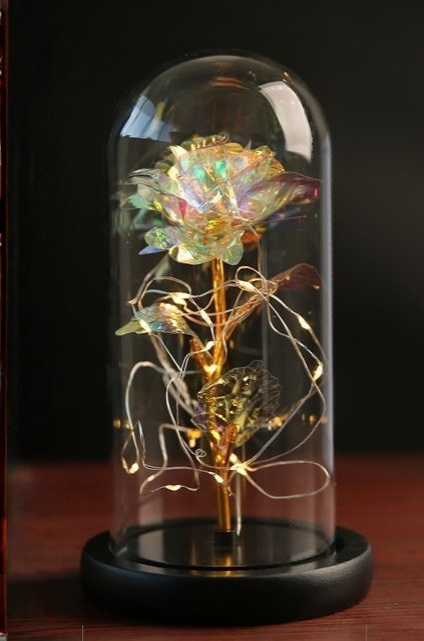 Lampe LED moderne, rose éternelle enchantée sous dôme de verre, crée une lumière d'ambiance unique.