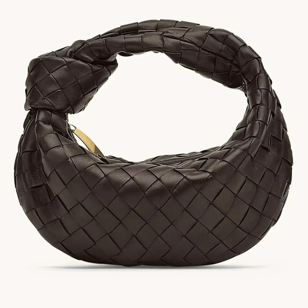 Sac multifonction femme en cuir. Doté de poches pratiques et d'une bandoulière amovible, très fonctionnel.