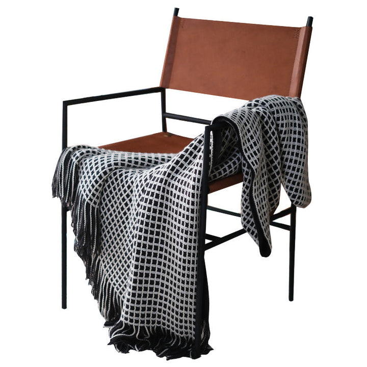 Plaid couverture tricotée grosses mailles en acrylique, douce et chaude pour un confort moderne au salon.