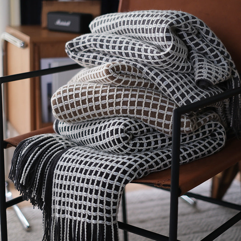 Couverture chaude et douce en tricot grosses mailles, apportant confort et une touche élégante à votre intérieur.