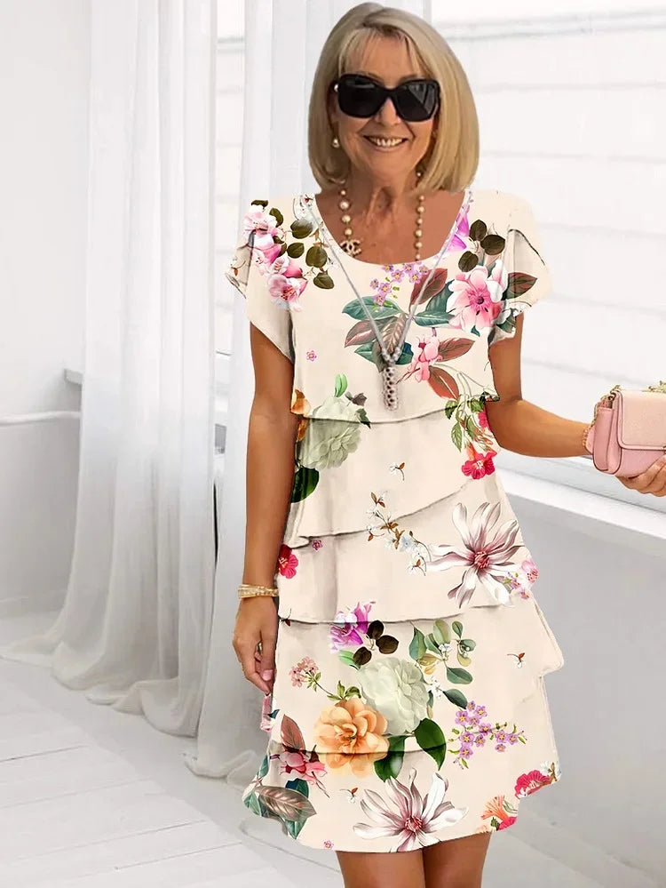Robe de soirée florale chic femme, coupe ajustée, parfaite pour cérémonies ou événements estivaux.