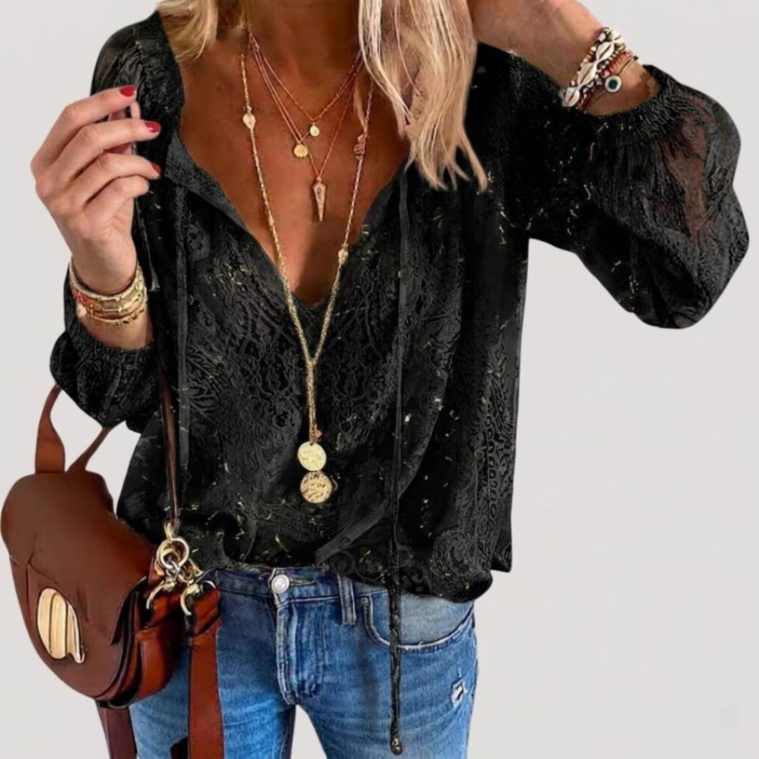 Blouse femme bohème chic et fluide, avec manches longues. Un indispensable élégant pour la saison printemps-été.
