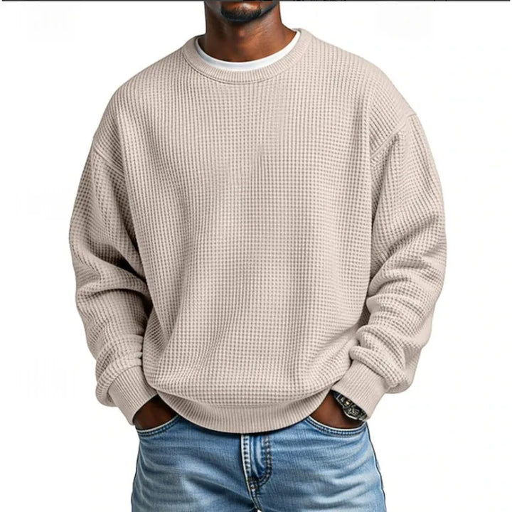 Vue de face d'un sweatshirt homme vert kaki, coupe décontractée. Pull confortable et moderne pour la saison froide.