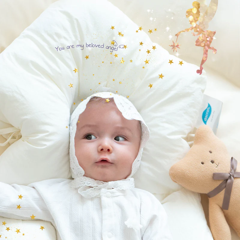 Coussin bébé ergonomique offrant un confort et soutien optimal pour le sommeil paisible des nouveau-nés.