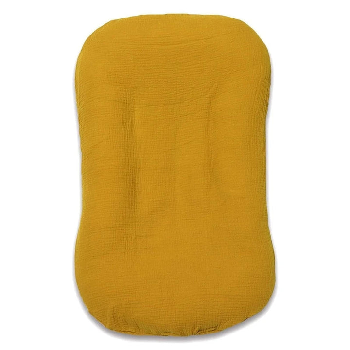 Nid de bébé pratique pour le cododo, offrant sécurité et confort au nouveau-né durant son repos.
