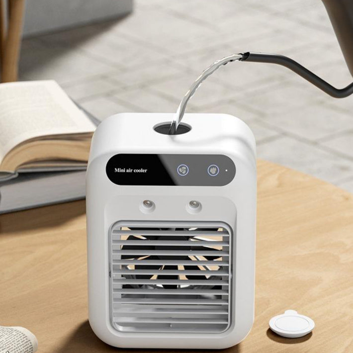 Climatiseur mini portable avec ventilation frontale, offre une brise fraîche personnalisée pour l'été. Facile à utiliser.