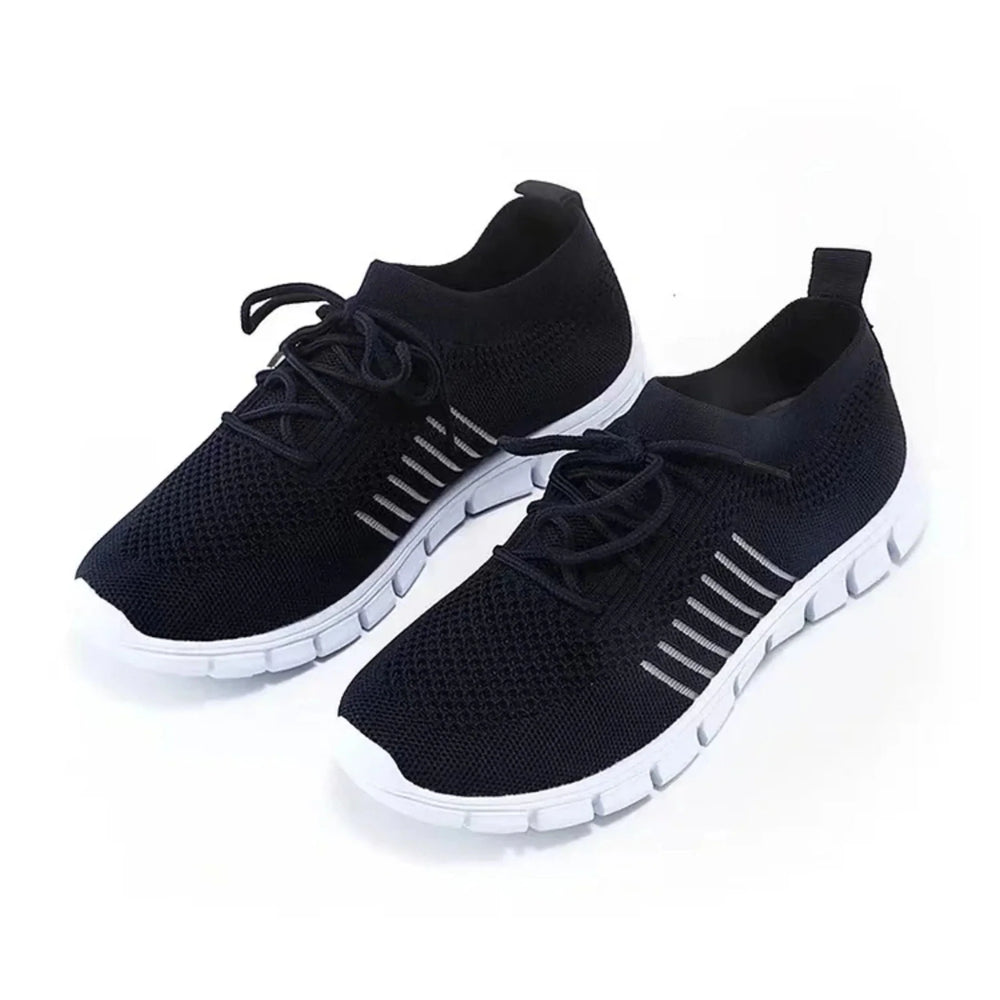 Basket femme noire en maille respirante, idéale pour le confort quotidien.