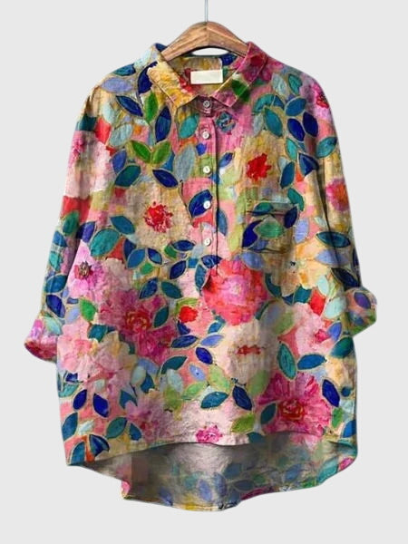 Chemisier femme à fleurs, style intemporel et chic, essentiel pour le printemps.
