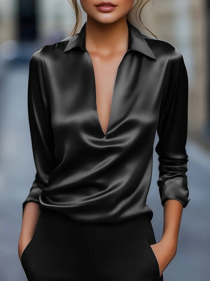 Haut polyvalent noir pour femme, col V et manches longues. Blouse fluide élégante, parfaite pour le bureau ou décontracté.