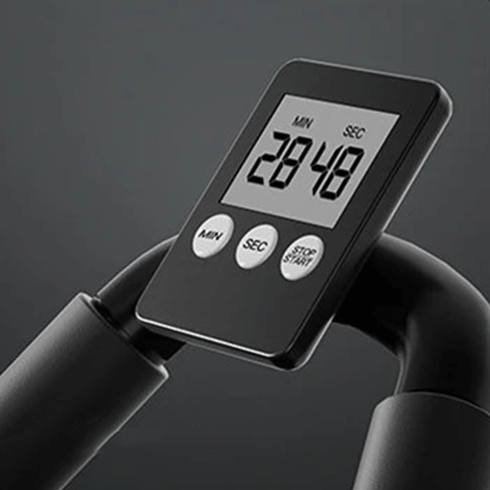 Vue de côté d'une personne s'entraînant avec l'appareil abdos Élite, activant les muscles du core.