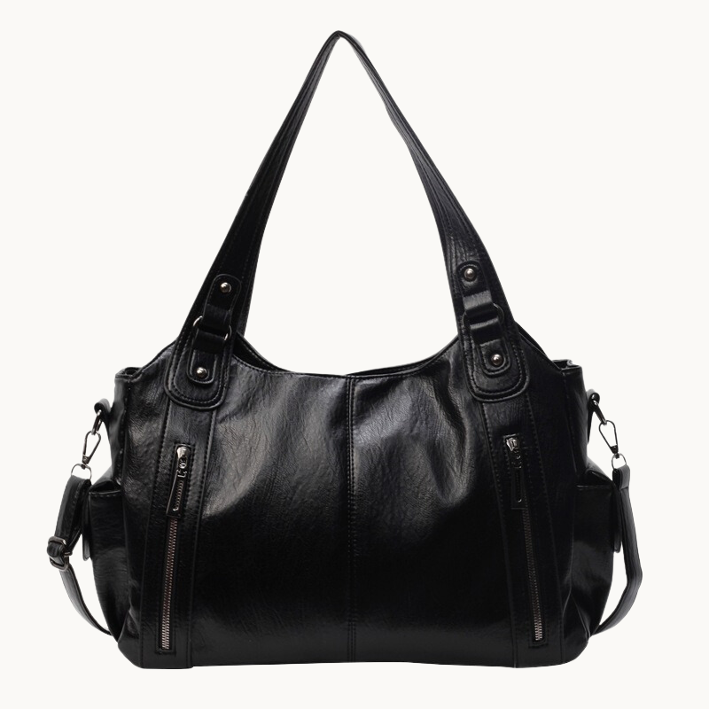 Intérieur organisé d'un sac à main rétro femme, multiples poches pour une meilleure organisation. Chic.