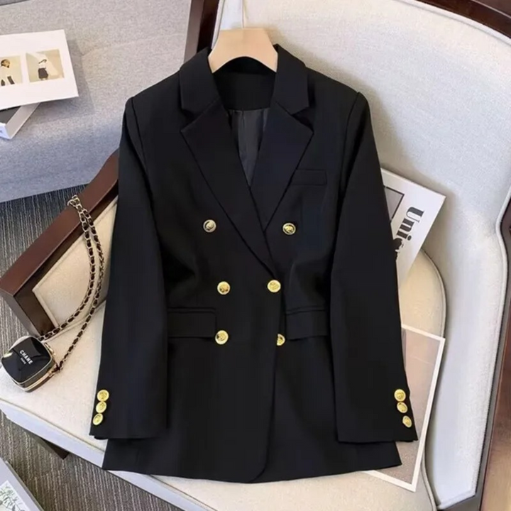 Veston femme chic à double boutonnage, revers classiques, parfait pour un look bureau ou décontracté.