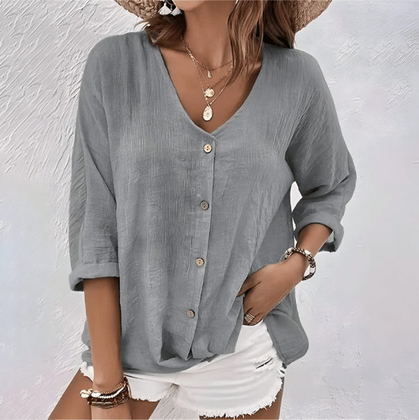 Haut femme élégant et casual à col V, manches courtes. Parfait pour un style quotidien chic ou mode printemps.