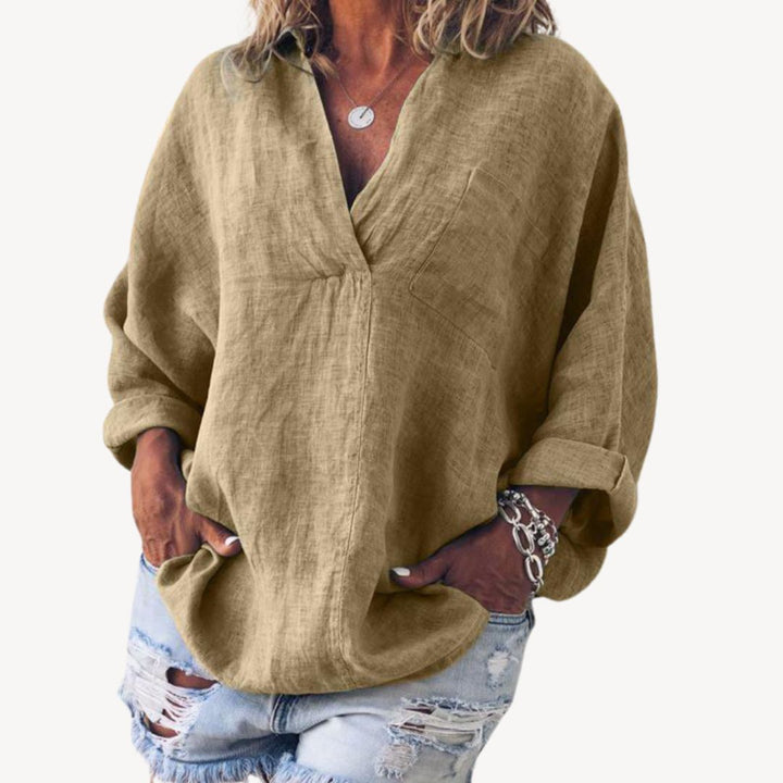Blouse femme élégante oversize, col V. Confortable et tendance, pour un style décontracté moderne.