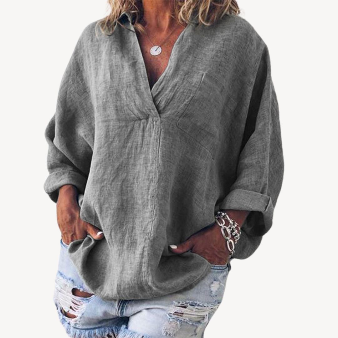 Manches longues blouse femme oversize, coupe ample et col en V. Un haut décontracté et chic.