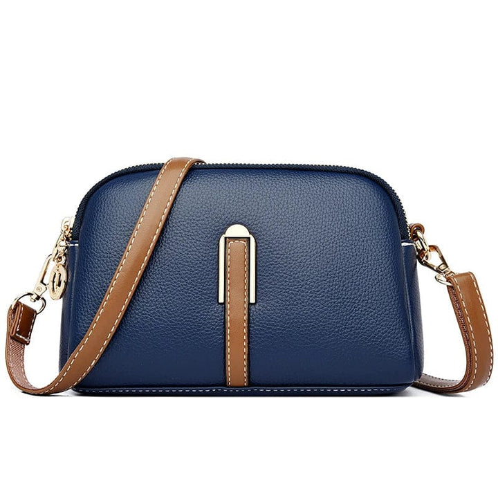 Sac à main femme tendance, cuir vegan bordeaux, style quotidien et chic raffiné.