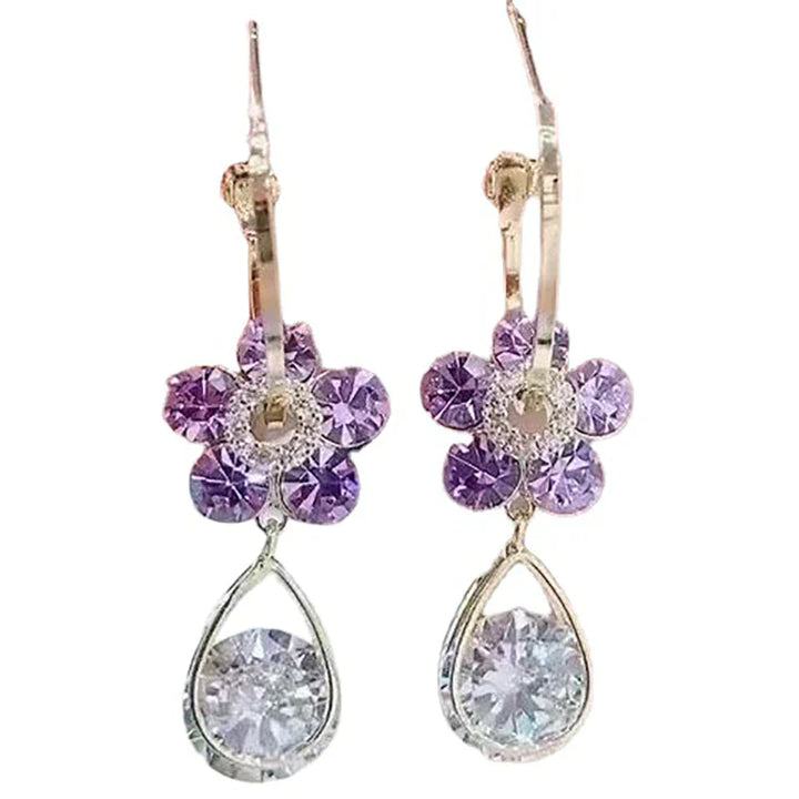 Boucles d'oreilles pendantes femme fleur de cristal, bijou floral bleu-violet, mode et élégance.