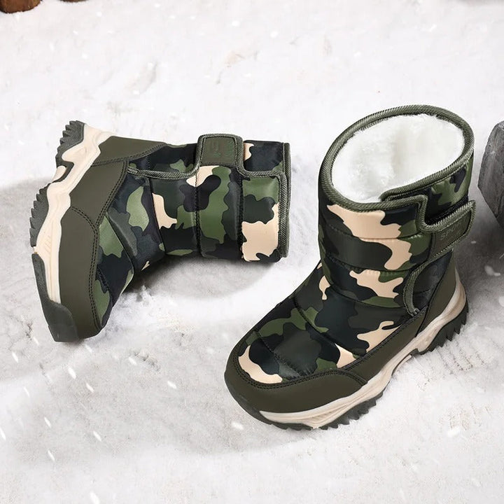 Paire de bottes de neige enfant, couleur vive, offrant chaleur, confort et protection optimale contre le froid.