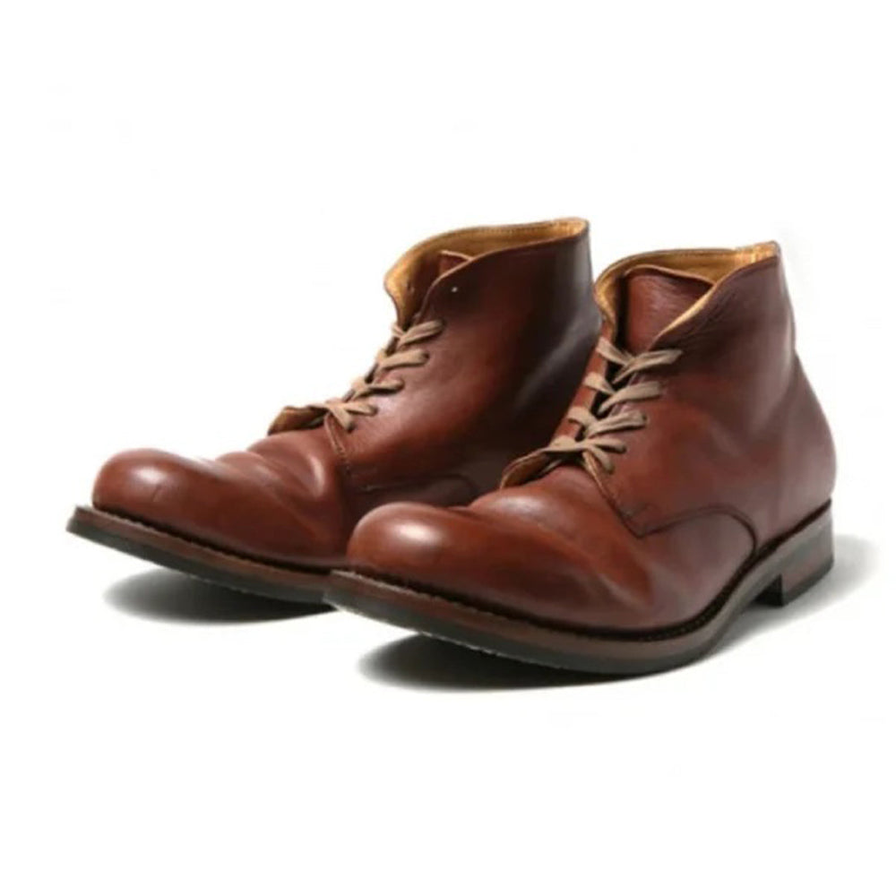 Bottes homme noires sophistiquées, idéales pour un look élégant décontracté en ville ou au bureau.