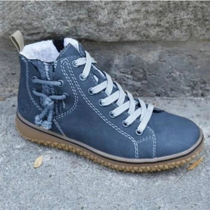 Bottines femme fourrées en similicuir noir, avec lacets et zip latéral pour l'hiver.
