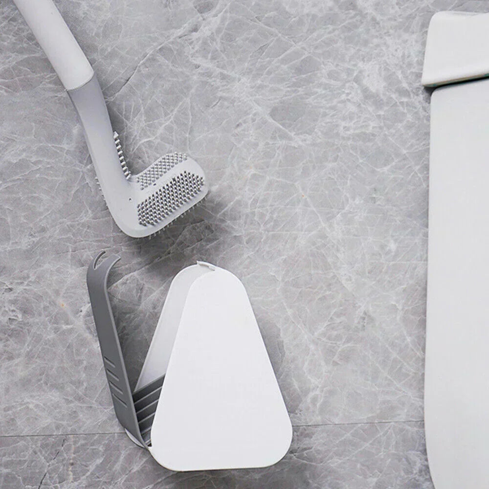 Brosse WC compacte avec support mural, design flexible et antibactérien, parfait pour optimiser l'espace dans la salle de bain.