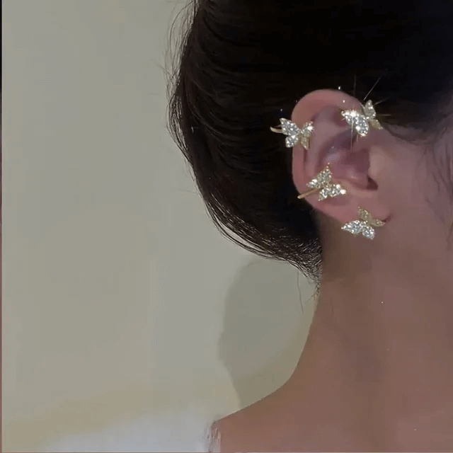 Boucles d'oreilles clip papillon dorées pour femme, avec détails en zircon, élégance sans perçage.