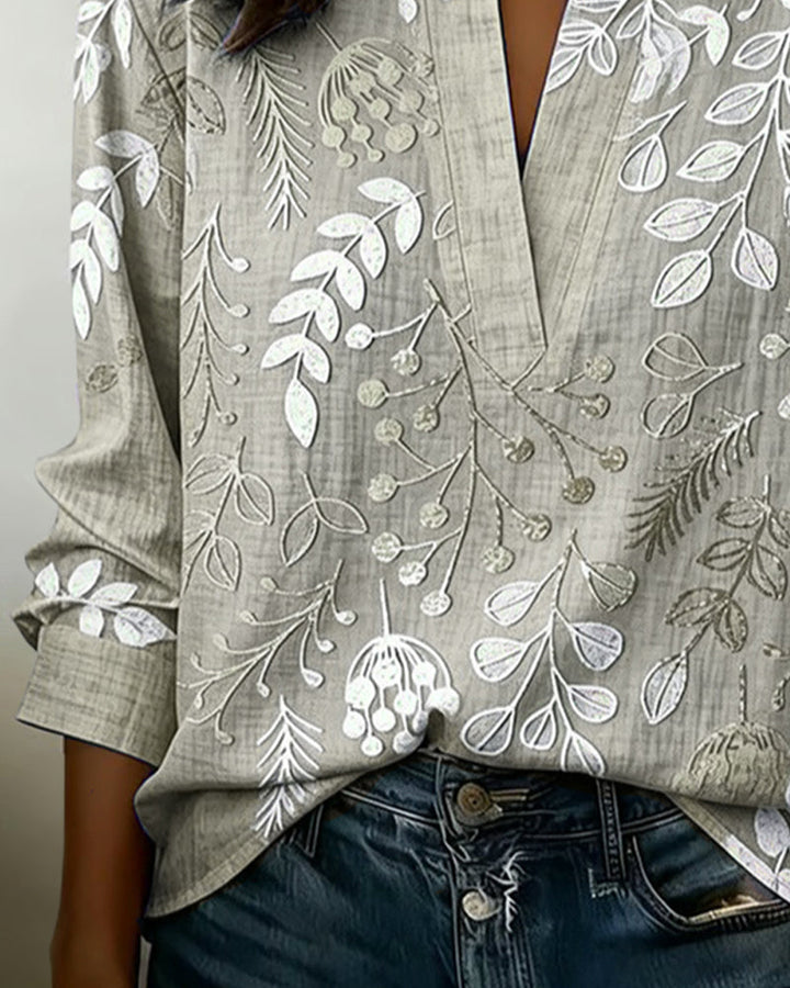 Chemisier femme à motif floral coloré, col V, coupe ample et fluide, très élégant et moderne.