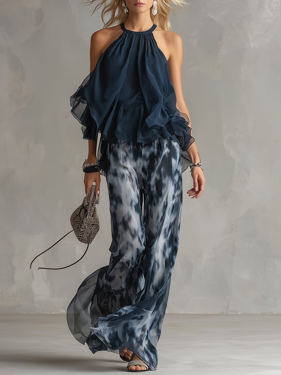 Ensemble femme élégant deux pièces bleu marine: top halter et pantalon large fluide. Parfait pour soirée chic.