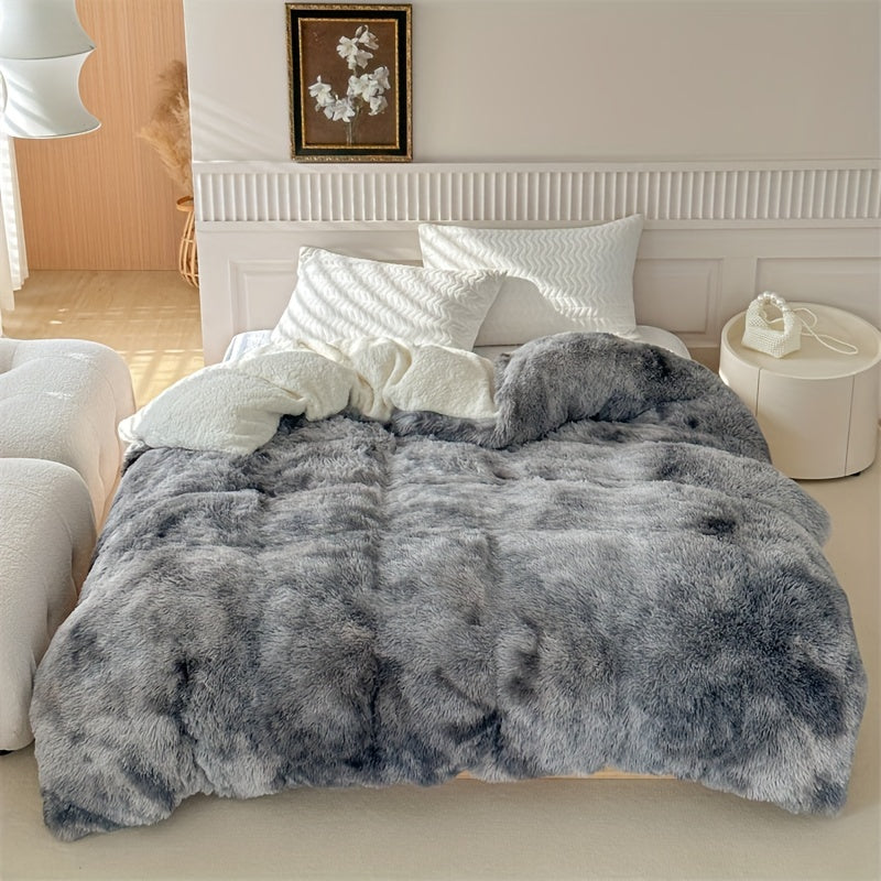 Plaid polaire luxueux offrant une chaleur douillette et un toucher peau de mouton incomparable.