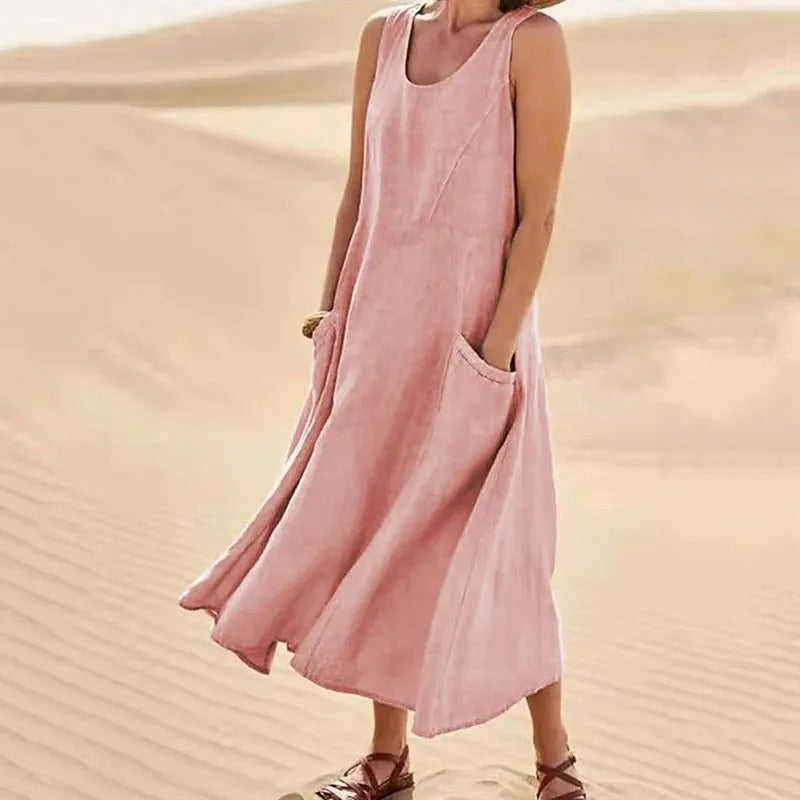 Robe longue femme fluide sans manches pour l'été, style décontracté et confortable, idéale pour la plage.