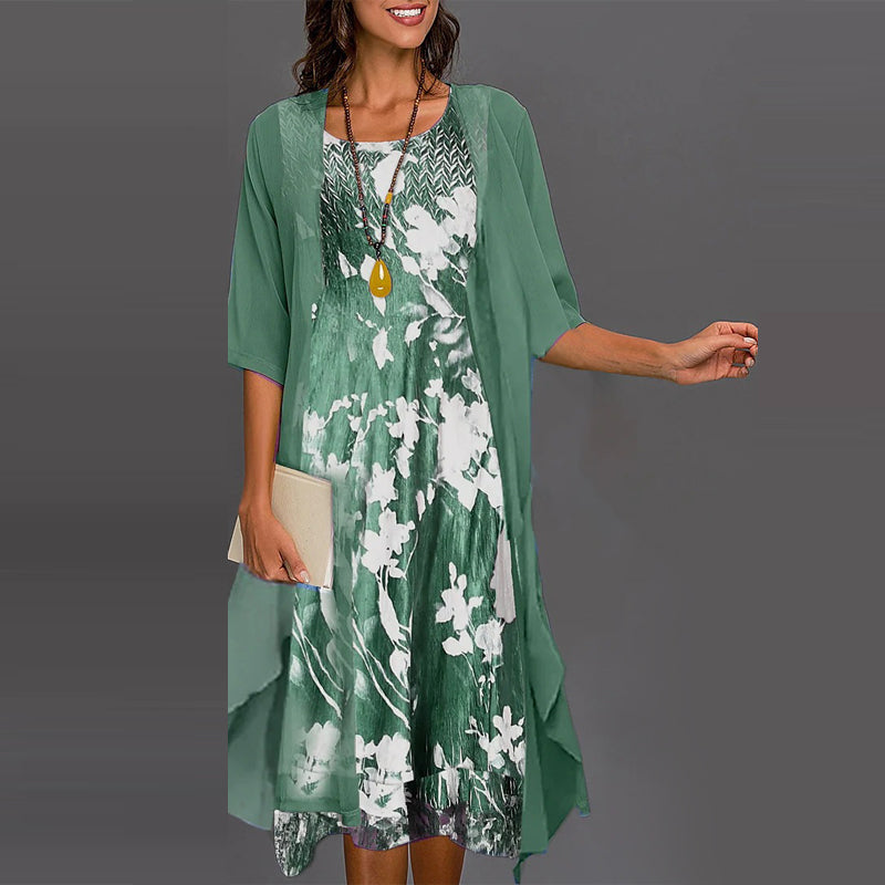 Robe femme fleurie midi élégante pour l'été, motif floral délicat, style féminin raffiné.
