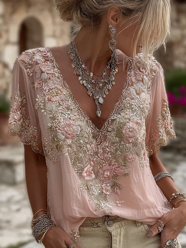 Blouse femme fleurie rose élégante avec décolleté V séduisant. Style bohème chic pour printemps/été.