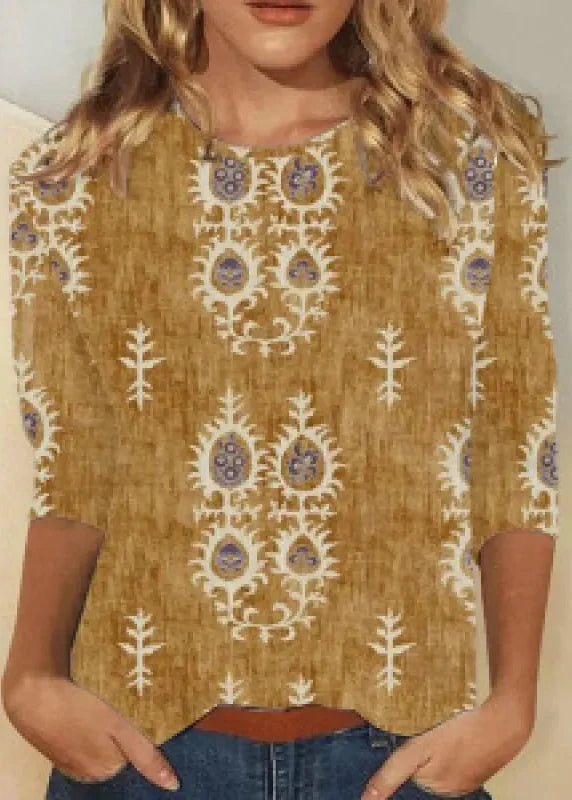 Haut femme manches longues élégant, imprimé floral dégradé. Look tendance col rond pour printemps/automne.