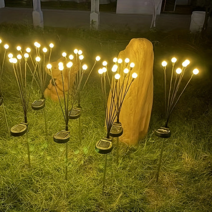 Lampe solaire LED lucioles pour jardin, créant une ambiance féerique. Éclairage extérieur écologique pour terrasse.