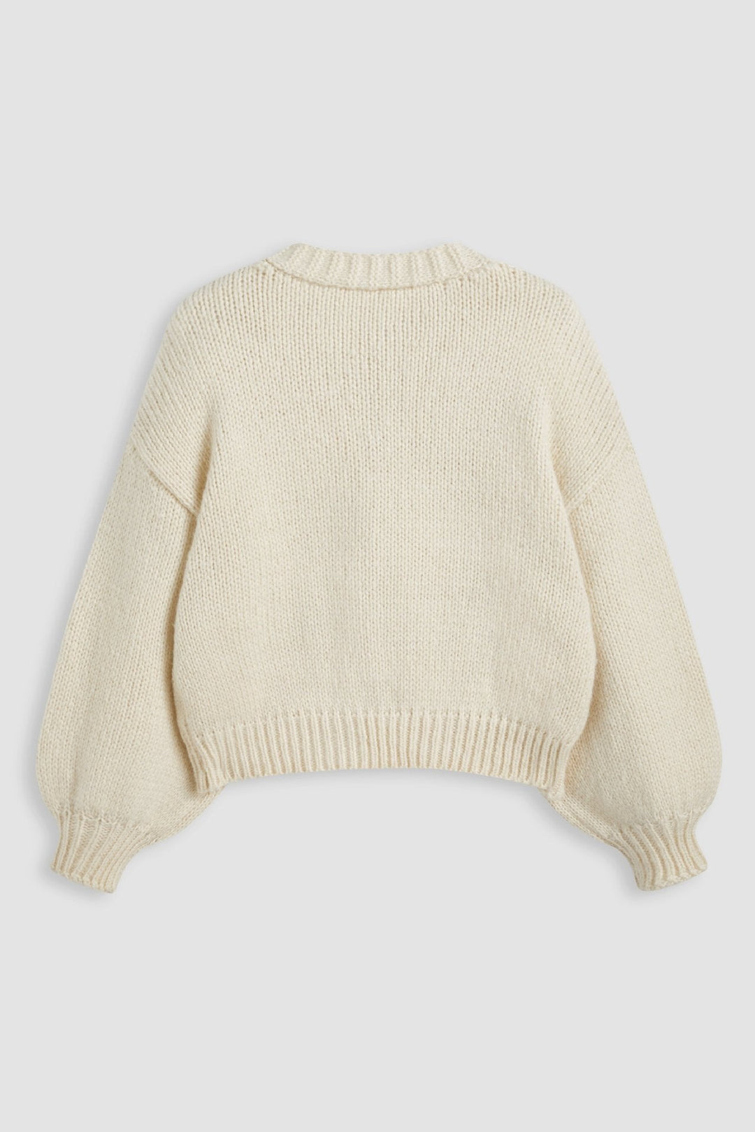 Mode féminine: cardigan ample, col V, avec détails cerises. Idéal pour un style décontracté d'automne.