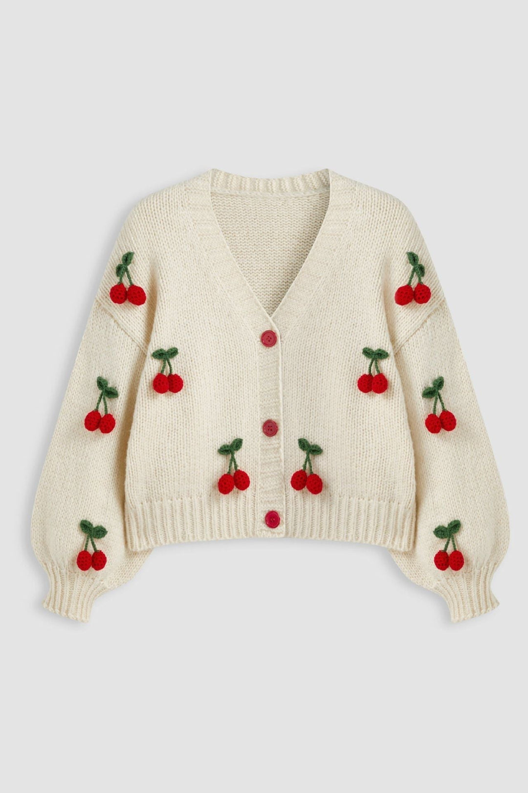 Cardigan ample pour femme, coupe oversize, col en V et motifs cerises. Un pull tendance et confortable.