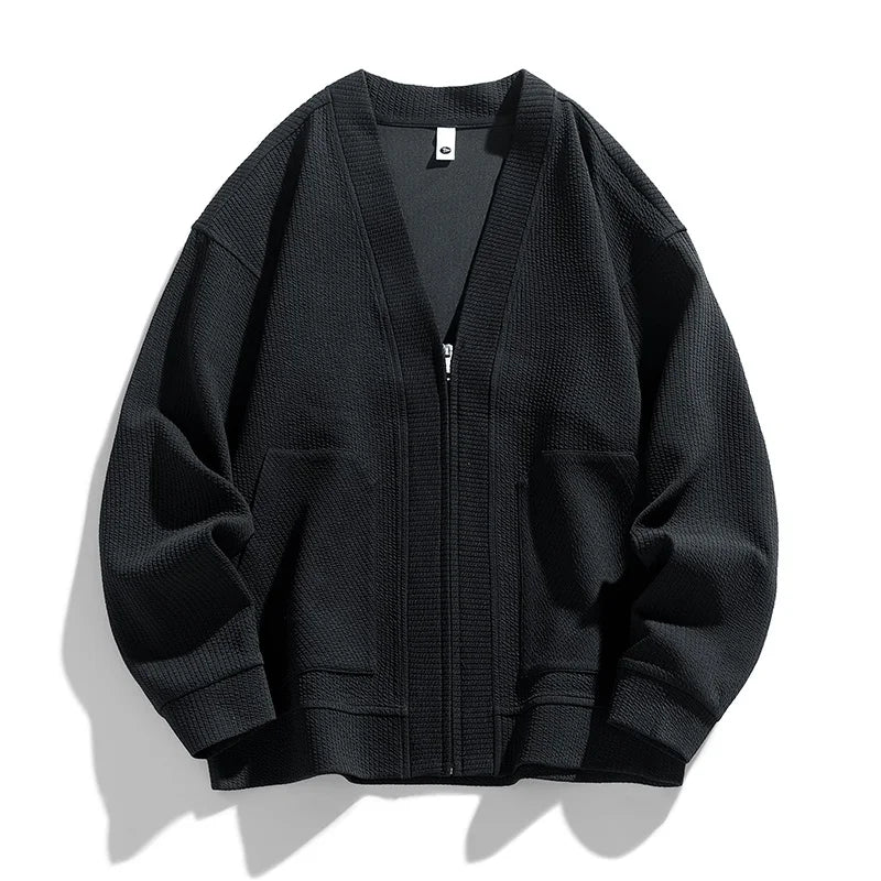 Pull cardigan zippé homme, chaud et texturé, avec poches fonctionnelles pour les journées fraîches.