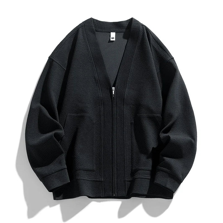 Pull cardigan zippé homme, chaud et texturé, avec poches fonctionnelles pour les journées fraîches.
