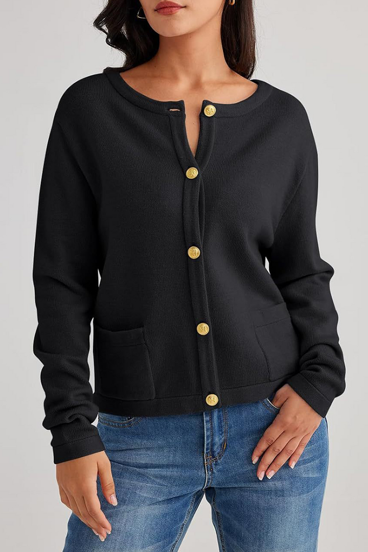 Cardigan Sorelia femme. Détails: col rond, rangée de boutons, poches. Style chic et élégant.