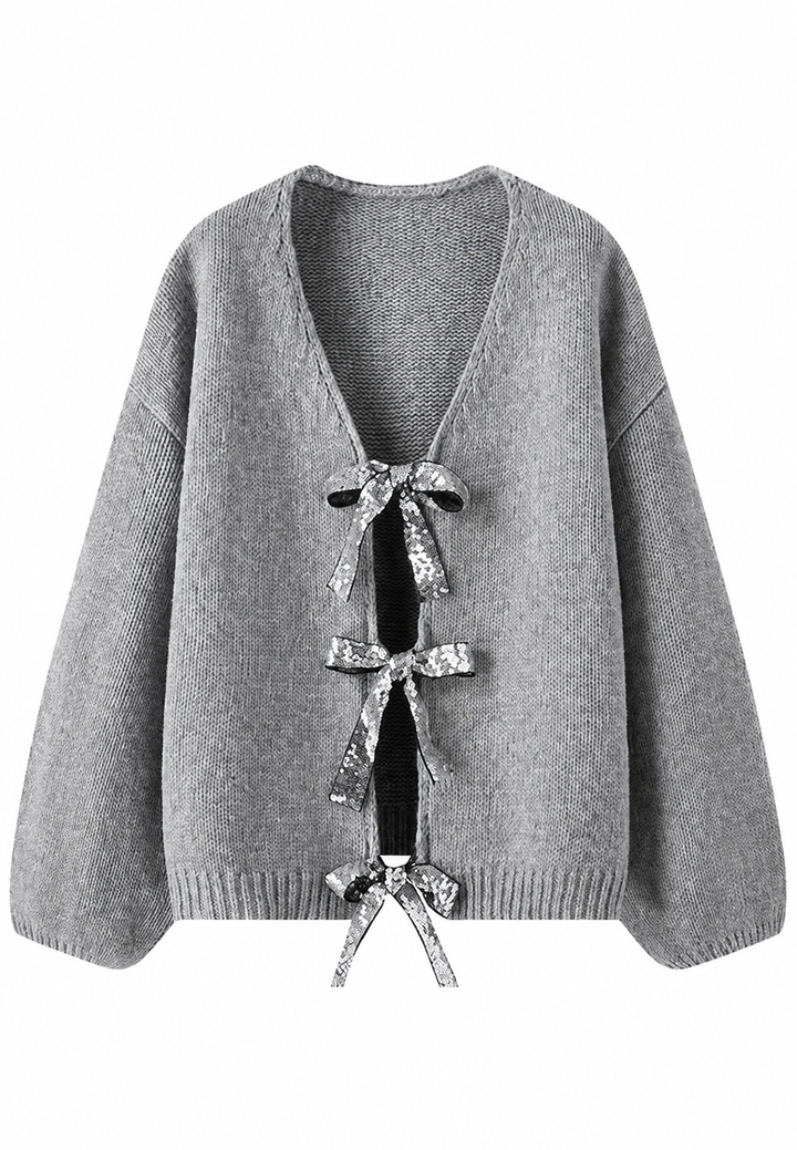 Cardigan femme chic, col en V et nœuds brillants. Une pièce élégante pour vos tenues de soirée hivernales.