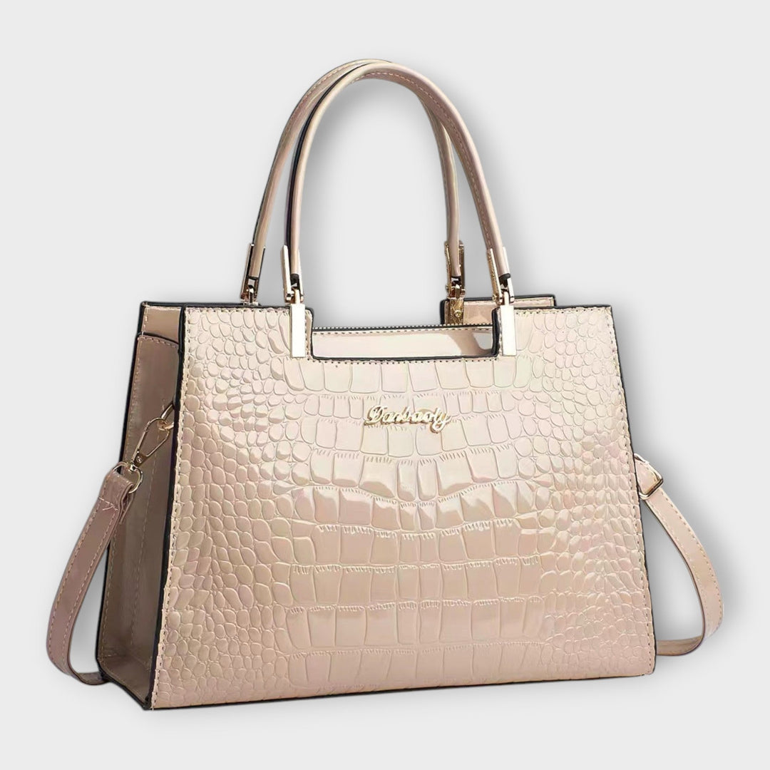 Sac à main femme luxe, motif crocodile brillant. Un design élégant pour compléter votre tenue de soirée.