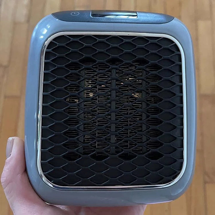 Petit chauffage d'appoint compact noir 800W, parfait pour une chaleur ciblée et économique dans n'importe quelle pièce.