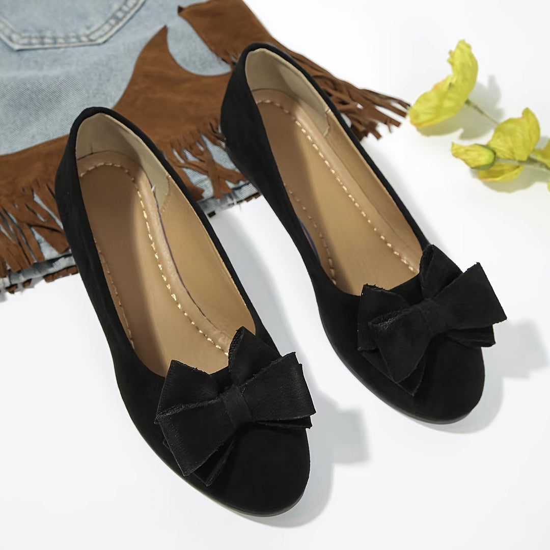 Chaussures plates orthopédiques noires femme, nœud, petit talon, pour un confort optimal.
