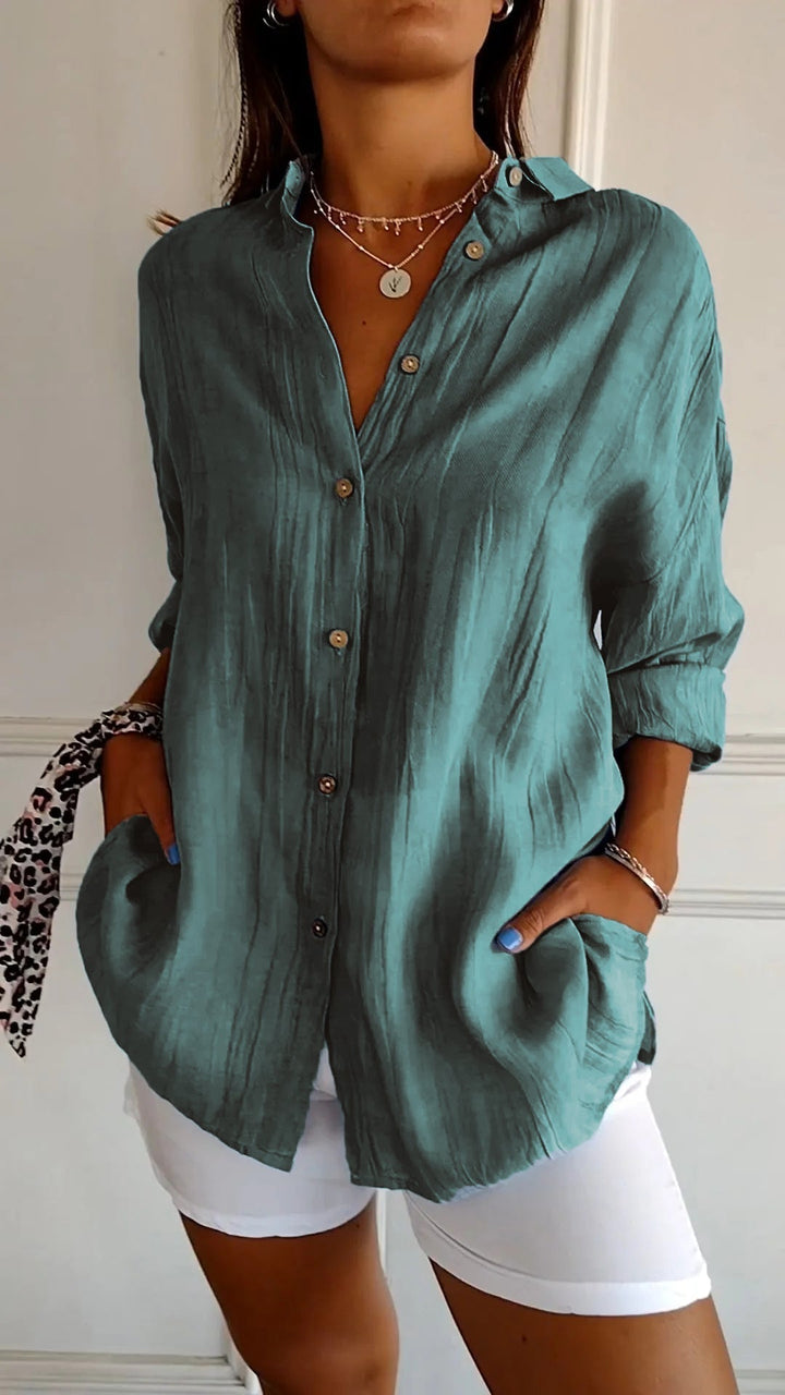 Chemisier femme tendance, plissé, manches longues, élégant, parfait pour une tenue chic et moderne.