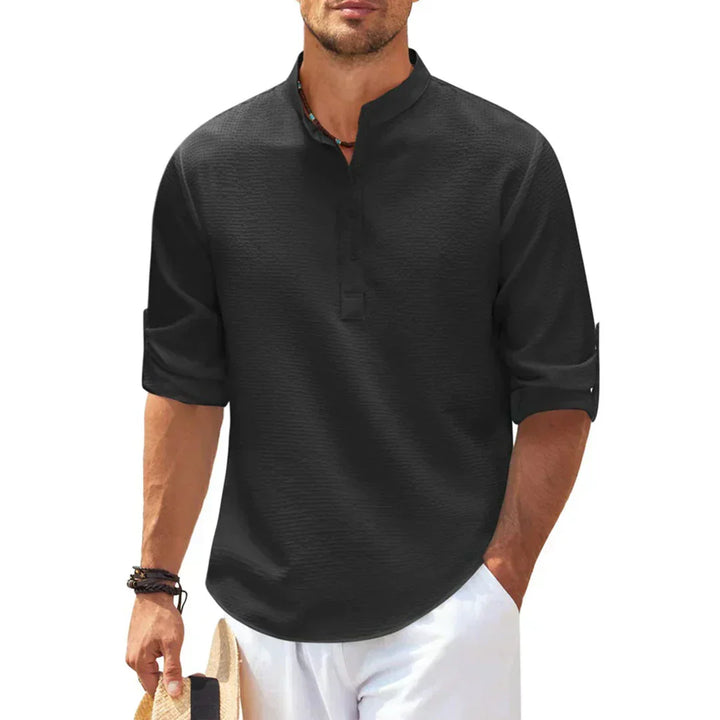 Chemise Henley homme texturée, col officier, manches longues. Style décontracté moderne et confort optimal.