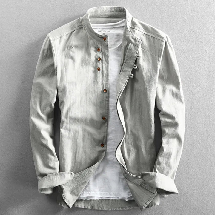 Chemise homme unie col mao, manches longues, élégante pour un style moderne et décontracté au quotidien.
