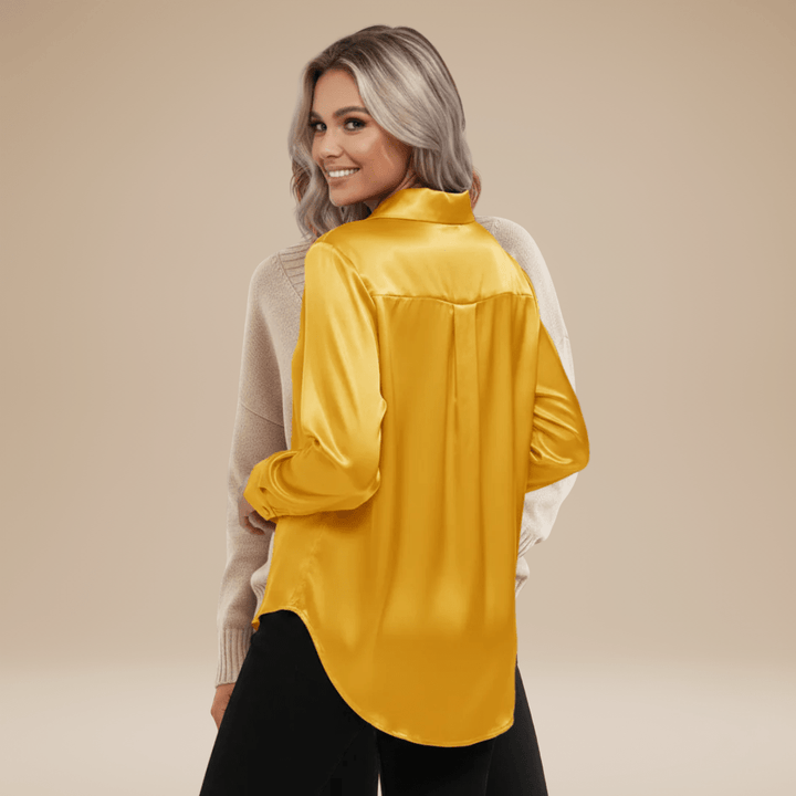 Chemisier élégant femme, idéal pour le travail ou une sortie décontractée chic.